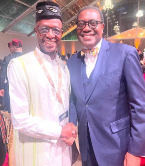 Djibril Diallo (g) en compagnie du président de la Banque africaine de développement (BAD), le Dr Adesina